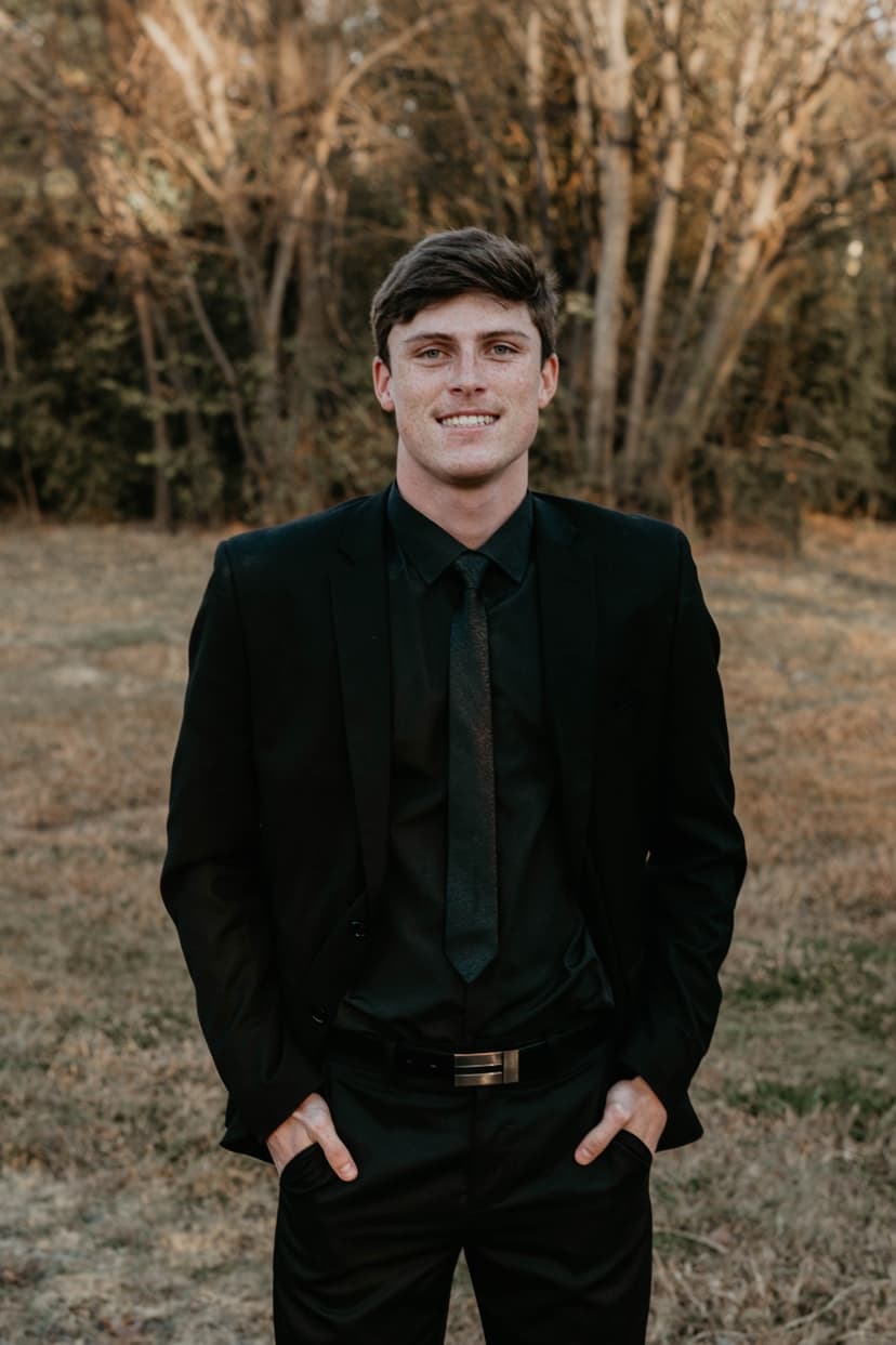A professional headshot of Neill Tuck